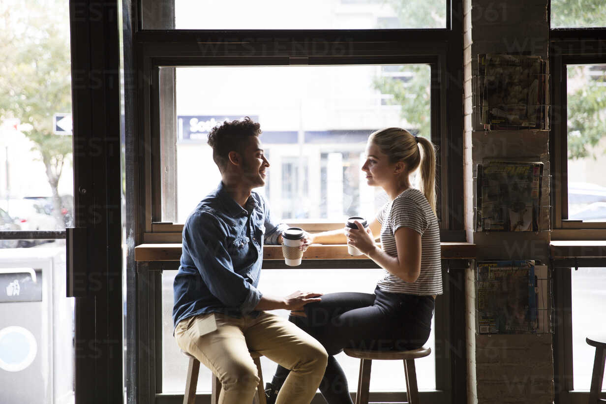 Confident man and woman talking